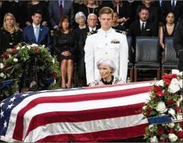  ?? ANDREW HARNIK / GETTY IMAGES ?? Roberta McCain, the 106-year-old mother of late Sen. John McCain, sits in front of his casket as he lies in state Friday in the Rotunda of the U.S. Capitol.