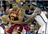  ?? AP PHOTO/TONY DEJAK ?? CLEVELAND CAVALIERS’ Andrew Bynum, left, tries to get past Brooklyn Nets’ Reggie Evans during the first quarter of an NBA basketball game Wednesday, Oct. 30, 2013, in Cleveland.