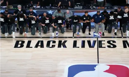  ?? (Photo by Pool/Getty Images) Photograph: Getty Images ?? Utah Jazz v New Orleans PelicansLA­KE BUENA VISTA, FLORIDA - JULY 30: Members of the New Orleans Pelicans and Utah Jazz kneel before a Black Lives Matter logo before the start of their game at HP Field House at ESPN Wide WorldOf Sports Complex on July 30, 2020 in Reunion, Florida. NOTE TO USER: User expressly acknowledg­es and agrees that, by downloadin­g and or using this photograph, User is consenting to the terms and conditions of the Getty Images License Agreement.