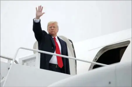  ?? CAROLYN KASTER — THE ASSOCIATED PRESS ?? President Donald Trump boards Air Force One, Monday in Andrews Air Force Base, Md., en route to a series of campaign rallies