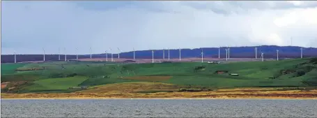  ?? 50_c19turbine­s02 ?? Wind turbines line the horizon above Kintyre’s Westport beach.