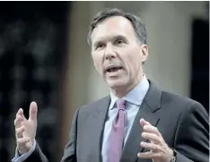  ?? ADRIAN WYLD/THE CANADIAN PRESS ?? Finance Minister Bill Morneau rises during question period in the House of Commons on Parliament Hill in Ottawa on Thursday. Morneau tried to reassure farmers that new tax reforms won’t affect their ability to pass on the family farm.