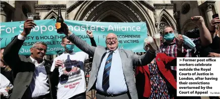  ?? Yui Mok ?? > Former post office workers celebrate outside the Royal Courts of Justice in London, after having their conviction­s overturned by the Court of Appeal