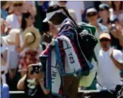  ?? AP PHOTO BY KIRSTY WIGGLESWOR­TH ?? Sloane Stephens of the U.S. walks off the court after being defeated by Donna Vekic of Croatia.