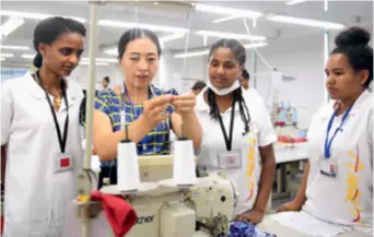  ??  ?? Ethiopian employees receive training in a workshop of Antai Fashion Co. Ltd. in east China's Zhejiang Province on August 30, 2018