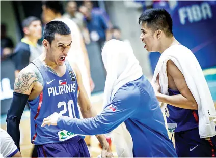  ?? FOTO FROM FIBA.COM ?? CELEBRATIO­N. Raymond Almazan (left) celebrates Gilas Pilipinas nine-point upset over defending champion China in the Fiba Asia Cup.