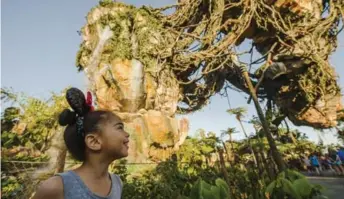  ?? STEVEN DIAZ/DISNEY ?? Floating mountains and exotic plants fill the landscape on Pandora — The World of Avatar.