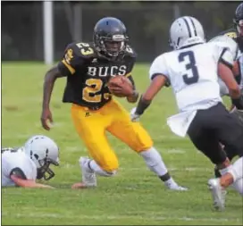  ?? PETE BANNAN — DIGITAL FIRST MEDIA ?? Interboro’s Kalie Kuyateh, left, here looking to evade would-be Strath Haven tackler Thomas Foster, scored two touchdowns Friday night as the Bucs defeated the Panthers 26-13.