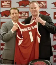  ??  ?? Eric Musselman and Arkansas Athletic Director Hunter Yurachek hold up a jersey at Musselman’s introducto­ry news conference on April 8, 2019. Musselman led the Razorbacks to a 20-12 record in his first season as coach.
(NWA Democrat-Gazette/David Gottschalk)