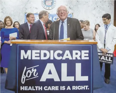  ?? AP FILE PHOTO ?? HEALTHY TURNOUT: Sen. Bernie Sanders is joined by Democratic senators and supporters at a news conference on Capitol Hill in Washington last year to unveil the Medicare for All legislatio­n.