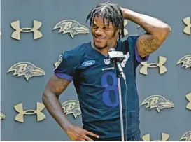  ?? KIM HAIRSTON/THE BALTIMORE SUN ?? Any speculatio­ns as to whether quarterbac­k Lamar Jackson, pictured last month at mandatory minicamp, will hold out of Ravens training camp until he signs a contract extension were seemingly put to rest on Thursday afternoon.