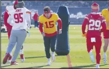  ?? Associated Press ?? Chiefs quarterbac­k Patrick Mahomes (15) runs with teammates during practice on Wednesday in Henderson, Nev. The Chiefs are scheduled to play the 49ers in Super Bowl 58 on Sunday in Las Vegas.