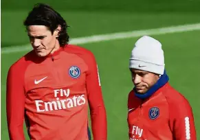  ??  ?? Paris St Germain’s Neymar (left) and Edinson Cavani during a training session on Thursday. — AFP Friendly feud: