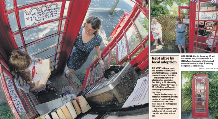  ?? PICTURES: BRUCE ROLLINSON ?? RED ALERT: Martha Kennerley, 10, and her mother Jane, in the phone box in St Hilda’s Road, Harrogate, which the local community wants to adopt. It’s already being used as a tiny library.