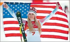  ?? CHRISTOPHE ENA/AP PHOTO ?? Bronze medal winner Lindsey Vonn of the United States celebrates during the flower ceremony for the women’s downhill on Feb. 21 at the Winter Olympics in Jeongseon, South Korea.