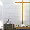  ?? Michael Cummo / Hearst Connecticu­t Media ?? The Rev. Robert Jackson wears a Nike shirt during a service at Bethel AME church in support of Colin Kaepernick and his campaign.