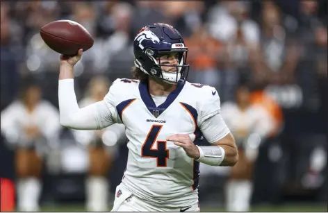  ?? ELLEN SCHMIDT — THE ASSOCIATED PRESS ?? Broncos quarterbac­k Jarrett Stidham throws a pass against the Las Vegas Raiders on Jan. 7 in Las Vegas.