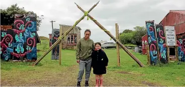  ?? CHRIS HARROWELL/ STUFF ?? Pania Newton and her young friend Leonye KeeganWite­hira Wehi at the entrance to the kaitiaki village.