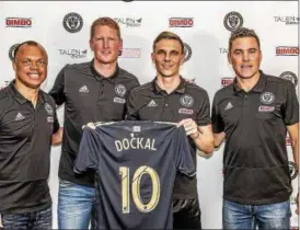  ?? SUBMITTED PHOTO ?? Borek Dockal, second from right, poses with, from left, Union sporting director Earnie Stewart, manager Jim Curtin and technical director Chris Albright after his signing Wednesday.