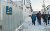  ?? RUSSIAN FEDERAL PENITENTIA­RY SERVICE ?? A group of officers walks inside a prison colony in Kharp, Russia.