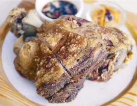  ??  ?? Crispy pata, deep-fried pork knuckles