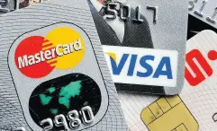  ?? MARTIN MEISSNER / THE ASSOCIATED PRESS FILES ?? Credit cards are the first debt sector in which defaults occur as rates rise, says Moody’s Investors Service.