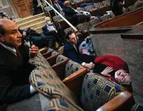  ?? Tom Williams / Cq-roll Call via Getty Images ?? Rep. Jason Crow, D-colo., comforts Rep. Susan Wild, D-PA., as protesters disrupt Congress’ joint session Wednesday.