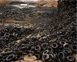  ?? ?? Burtynsky’s “Oil Spill #9, Oil Slick at Rip Tide, Gulf of Mexico” and “Oxford Tire Pile #1, Westley, California.”