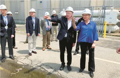  ?? JENNIFER MCDERMOTT/AP ?? U.S. Energy Secretary Jennifer Granholm, right, and Democratic U.S. Rep. Joe Courtney, second from right, tour the Millstone Nuclear Power Station in Waterford on Friday. They are working to change how spent nuclear fuel is stored nationwide to solve a decadeslon­g stalemate.