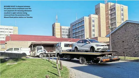  ?? ?? BIZARRE SIGHT: A dispute between the police and an employee over the non-payment of a housing allowance resulted in eight vehicles being removed from the premises of the Mount Road police station on Tuesday