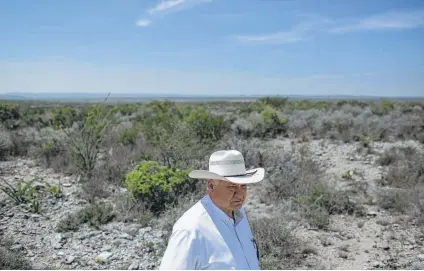  ?? Tamir Kalifa / New York Times ?? Joe Martinez, Val Verde County sheriff, walks along a ranch near the U.S.-Mexico border. Martinez has helped test lidar sensors and believes they could be helpful in some areas of the border.