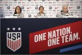  ?? SETH WENIG — THE ASSOCIATED PRESS ?? United States women’s national soccer team members, from left, Carli Lloyd, Alex Morgan and Megan Rapinoe speak to reporters during a news conference in New York on May 24.