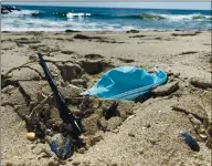  ?? PHOTO BY MADDIE BLACK, OCEAN CONSERVANC­Y ?? A new study by the Ocean Conservanc­y documents how the pandemic has added to trash with plastic content ending up on beaches and in the ocean.