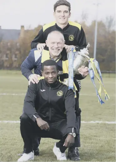  ??  ?? Former Scottish Cup-winning manager John Hughes promotes this afternoon’s third-round tie along with Lothian Thistle Hutchison Vale players Sam Nhamburo, front, and Grant Munro.