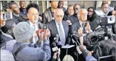  ?? PICTURE: EPA ?? Former judge Johan Kriegler, centre, and lawyer George Bizos, right, address the media at the head offices of the Hawks police unit after after Finance Minister Pravin Gordhan failed to appear at the SAPS offices in Pretoria yesterday. Gordhan rejects...