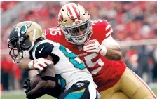  ?? TONY AVELAR/ASSOCIATED PRESS ?? Former 49ers safety Eric Reid (35), shown making a tackle in December, had a grievance filed on his behalf by the NFLPA.