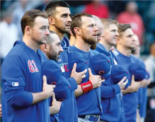  ?? AP ?? Ben Zobrist (center), who began a training period in the minors Friday at Class A South Bend, hopes to rejoin the Cubs in September after a lengthy absence.