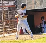  ?? Eric Sondheimer Los Angeles Times ?? MATT QUINTANAR, waiting to hit in the on-deck area, enjoys controllin­g the action as Hart’s catcher.