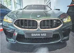  ?? BLOOMBERG ?? A BMW M8 stands inside a showroom in Frankfurt on Tuesday.