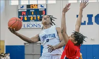  ?? Jim Franco / Times Union ?? Mekeel Christian Academy’s Terrance Robinson drives to the basket in front of Fannie Lou Hamer defender Amir Hughes on Saturday. Mekeel Christian rolled to a 71-45 victory.