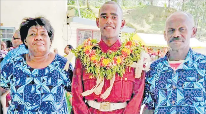  ?? Picture: SUPPLIED ?? Apenai Koroiwasa with mum Jiu and dad Tuni Sarasau during the passing-out parade.