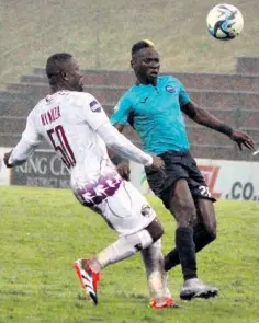  ?? ?? NRB goal scorer Khuda Muyaba and Swallows’ Ntsikelelo Nyauza battle for possession in the pouring rain