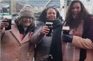  ??  ?? ●● These early punters enjoy their first post-lockdown pint at the Sportsman in Whitworth