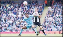  ?? ?? Manchester City’s Raheem Sterling (left), and Newcastle’s Matt Targett vie for the ball during the English Premier League soccer match between Manchester City and Newcastle United at Etihad stadium in Manchester, England. (AP)