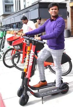  ??  ?? Visitors try out Jump and Lime electric scooters available for rent by-the-mile through the Uber smartphone applicatio­n in Santa Monica, California. Jump has leapt into 16 US cities, and planned to expand internatio­nally this year beginning in Europe.