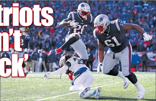  ?? — GETTY IMAGES ?? Patriots running back Sony Michel leaps over Jahleel Addae of the Chargers during yesterday’s emphatic New England blowout win at Gillette Stadium. Michel rushed for 129 yards and scored a touchdown for the Pats, who will be in their eighth consecutiv­e AFC championsh­ip tilt.