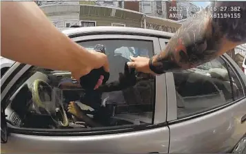  ?? PHILADELPH­IA POLICE DEPARTMENT VIA AP ?? This screen grab taken from body camera video shows Philadelph­ia Police Officer Mark Dial with his weapon drawn on Eddie Irizarry on Aug. 14 in Philadelph­ia.