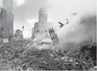  ?? FILE ?? Fires burn amid the rubble of the World Trade Center on Sept. 13, 2001, two days after the terrorist attack in New York City.