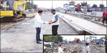  ??  ?? Public Works and Highways Secretary Mark Villar talks to officials supervisin­g the constructi­on of Radial Road 10 yesterday.