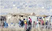  ??  ?? Internally displaced persons in Sortoni, in Sudan’s North Darfur state, who fled their homes following ongoing clashes between armed movements and government forces in the Jebel Marra area on Feb 9.